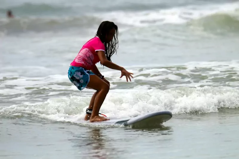 Girl surfing at Santa Teresa, Costa Rica.