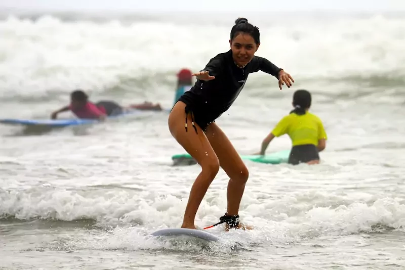 Teenager surfing at Santa Teresa, Costa Rica.