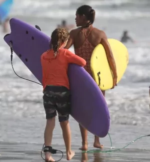 surf instructor with kid