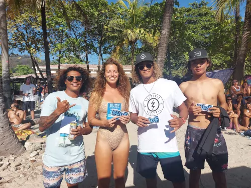 Tag Team Surf participants showing their coupon prize