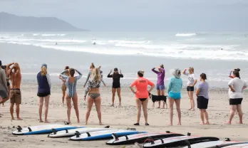 group of people receiving surf lesson